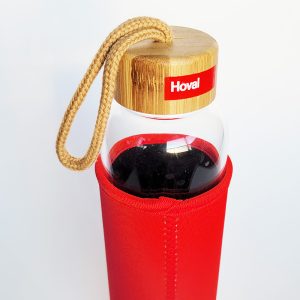 glass bottle with neoprene sleeve with bamboo top